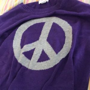 I’m selling a sweater with a Peace sign on it